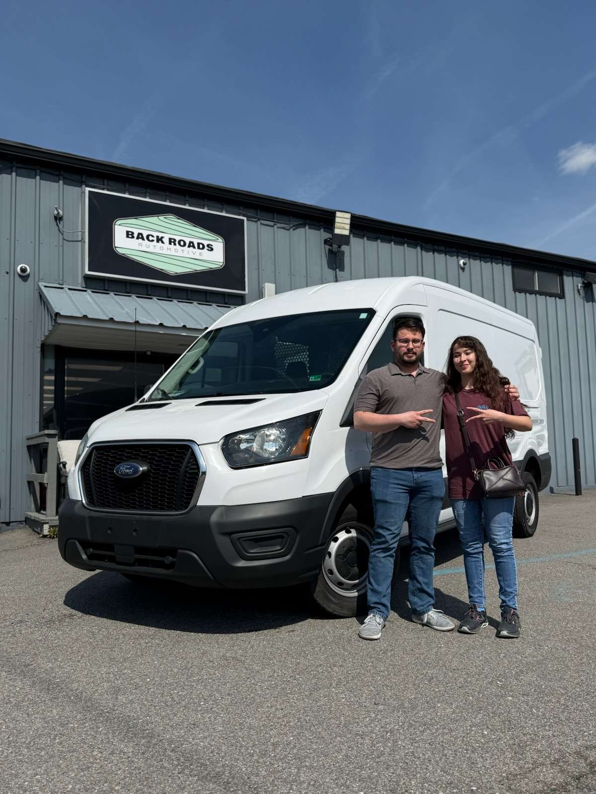 Rivera Colon Supply & Logistics LLC cargo van with team members standing beside it